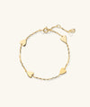 Heart Station Bracelet featuring gold hearts linked together, creating a delicate and stylish fashion accessory perfect for any occasion.